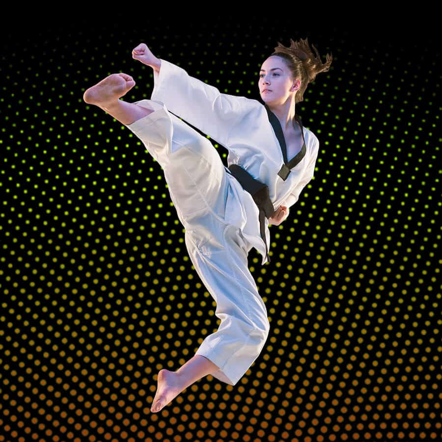 Martial Arts Lessons for Adults in Wauconda IL - Girl Black Belt Jumping High Kick